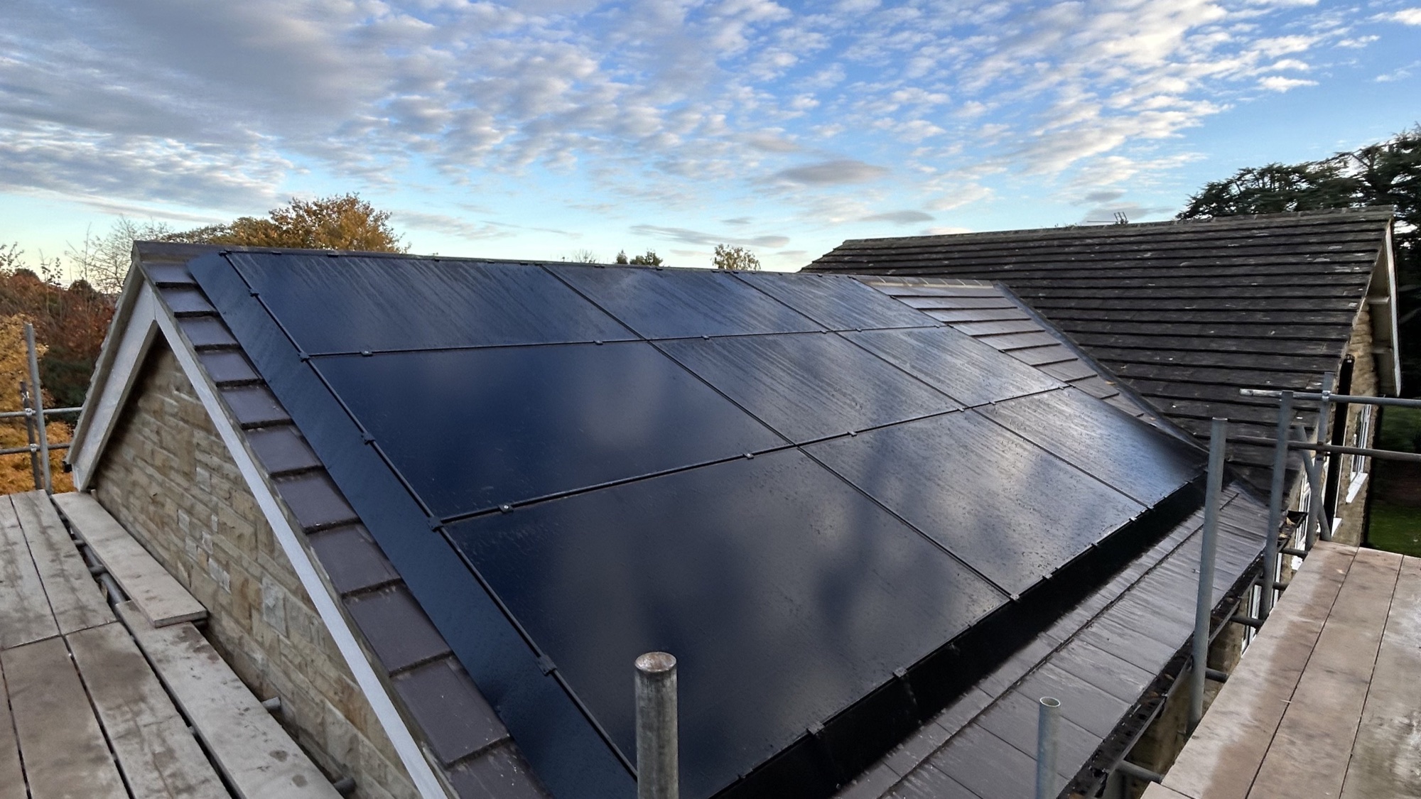 All-black rooftop solar panel array installed in Copgrove