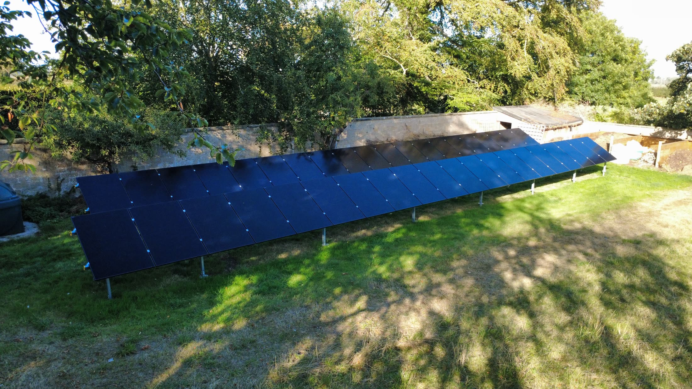 Close aerial view of the LONGi all-black ground-mounted solar panels
