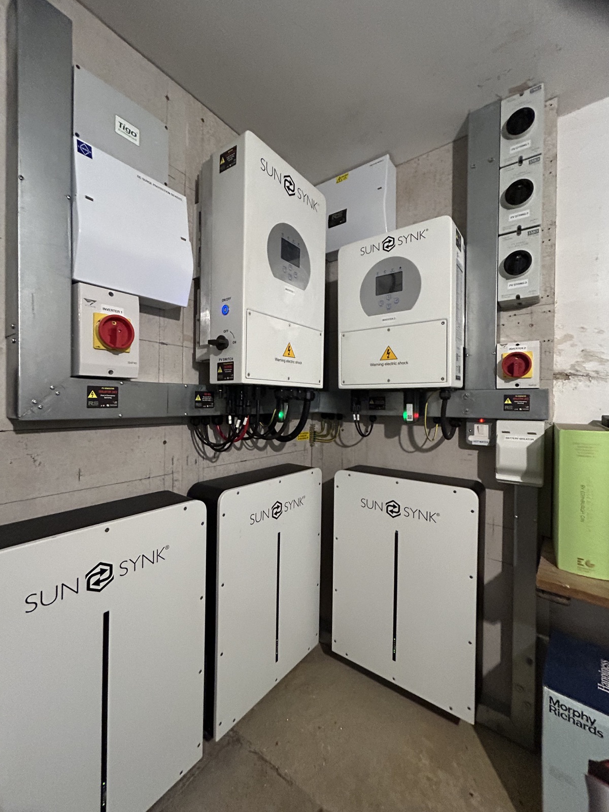Sunsynk 8 kW and 3.6 kW inverters with three 5 kWh batteries and Tigo equipment