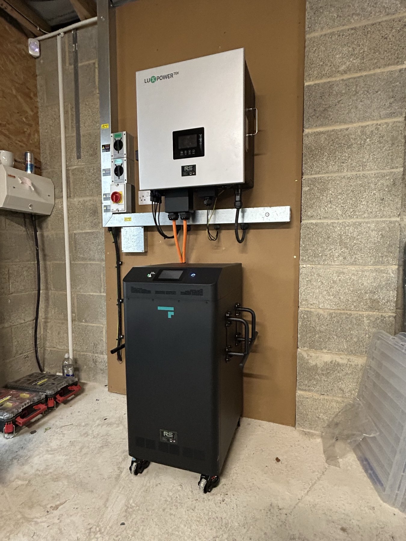 Front view of the 10 kW LuxPower hybrid inverter and 32 kWh Fogstar battery in Shadwell