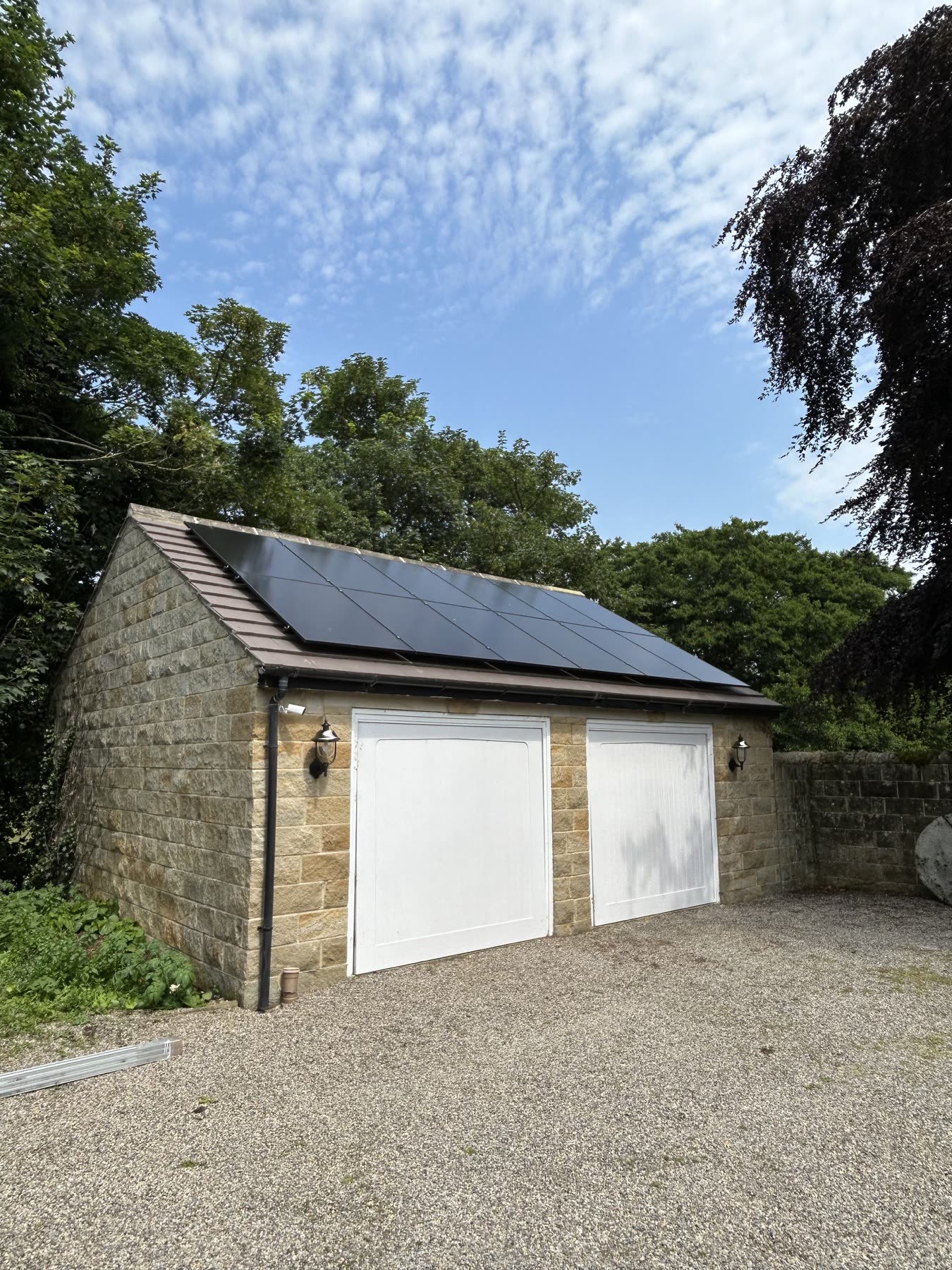 All-black AIKO solar panels installed on the garage roof in Weeton