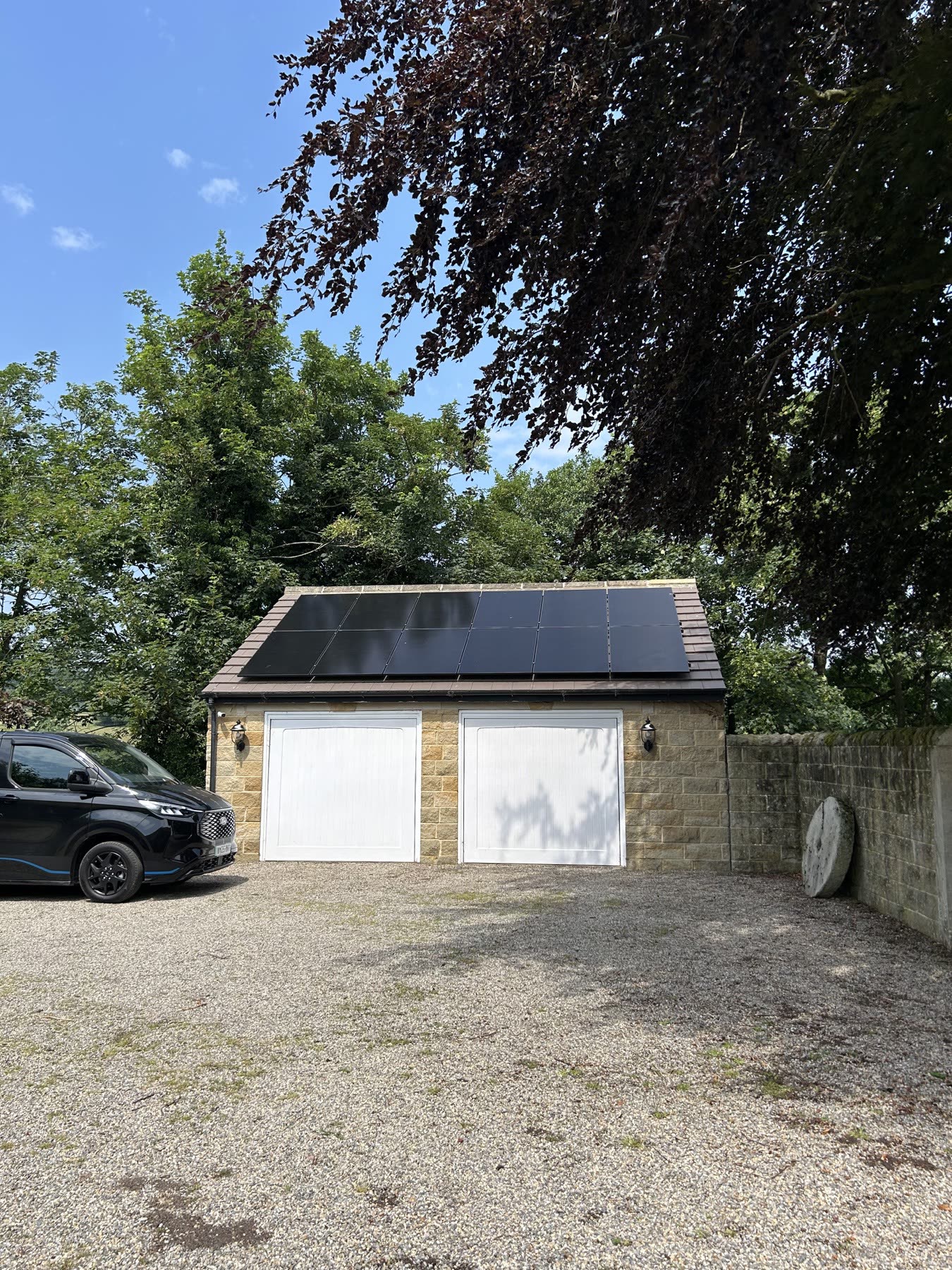 Front view of the garage-mounted all-black solar array in Weeton